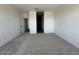 Cozy bedroom with plush carpeting, a walk-in closet, and neutral paint at 46963 W Coe St, Maricopa, AZ 85139