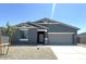 Charming single-story home featuring a neutral color scheme, low maintenance landscaping, and attached two-car garage at 46963 W Coe St, Maricopa, AZ 85139