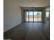 Spacious living area features tile flooring and sliding glass doors to the backyard at 46963 W Coe St, Maricopa, AZ 85139