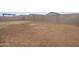 New home construction featuring a blank canvas backyard surrounded by a cinder block wall at 4994 W Hunter Trl, San Tan Valley, AZ 85144