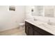 Bathroom features a double vanity, mirror, and toilet at 4994 W Hunter Trl, San Tan Valley, AZ 85144