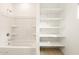 Bathroom featuring a shower/tub combo and shelving at 4994 W Hunter Trl, San Tan Valley, AZ 85144
