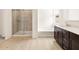 Bright bathroom with tiled shower, free-standing tub, and dark wood vanity at 4994 W Hunter Trl, San Tan Valley, AZ 85144