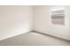Bedroom with neutral carpet, window, and neutral paint at 4994 W Hunter Trl, San Tan Valley, AZ 85144