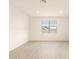 Bedroom featuring a window, light wood floors, and neutral paint at 4994 W Hunter Trl, San Tan Valley, AZ 85144