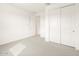 Bedroom with neutral carpet and closet with sliding doors at 4994 W Hunter Trl, San Tan Valley, AZ 85144