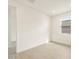 Bright bedroom featuring a window, light wood floors, and neutral paint at 4994 W Hunter Trl, San Tan Valley, AZ 85144