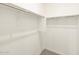 Walk-in closet with ample shelving and space for storage at 4994 W Hunter Trl, San Tan Valley, AZ 85144