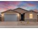 Charming single-story home showcasing a neutral color scheme, a gray garage door, and a well-manicured front yard at 4994 W Hunter Trl, San Tan Valley, AZ 85144