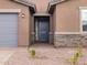 Close up shot of a well-maintained entrance featuring a brick walkway and low maintenance landscaping at 4994 W Hunter Trl, San Tan Valley, AZ 85144