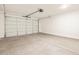New two car garage with white walls and sealed concrete floors at 4994 W Hunter Trl, San Tan Valley, AZ 85144