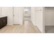 Hallway leading to the bath and bedroom with tile flooring at 4994 W Hunter Trl, San Tan Valley, AZ 85144