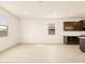 Open floorplan living room with bright light and tile floors at 4994 W Hunter Trl, San Tan Valley, AZ 85144