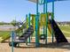 Community playground featuring slides, climbing wall, and covered shade structure for outdoor fun at 4994 W Hunter Trl, San Tan Valley, AZ 85144