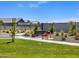 Scenic walking path through the community park, featuring benches and native landscaping at 4994 W Hunter Trl, San Tan Valley, AZ 85144