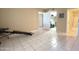 Spacious bedroom with tiled floors and access to hallway at 10330 W Thunderbird Blvd # C216, Sun City, AZ 85351