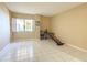 Bright bedroom with tiled floors and large window at 10330 W Thunderbird Blvd # C216, Sun City, AZ 85351