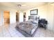 Bedroom with a queen bed and an ensuite bathroom at 10330 W Thunderbird Blvd # C216, Sun City, AZ 85351