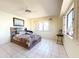 Comfortable bedroom with ceiling fan and ensuite bathroom access at 10330 W Thunderbird Blvd # C216, Sun City, AZ 85351
