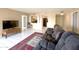 Comfortable living room with a view into the kitchen and neutral color palette, ideal for relaxation at 10330 W Thunderbird Blvd # C216, Sun City, AZ 85351