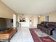 Cozy living room featuring modern furniture and a pass-through to the kitchen, perfect for entertaining at 10330 W Thunderbird Blvd # C216, Sun City, AZ 85351