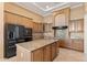 Kitchen with stainless steel appliances and granite island at 12377 W Desert Vista Trl, Peoria, AZ 85383