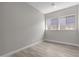 Bright bedroom features wood-look floors and dual windows for ample natural light at 32513 N 135Th Dr, Peoria, AZ 85383