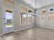 Dining area boasting high ceilings, stylish lighting, and large windows for natural light at 32513 N 135Th Dr, Peoria, AZ 85383