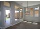 Sun-filled dining area featuring multiple windows and wood-look flooring for a warm, inviting ambiance at 32513 N 135Th Dr, Peoria, AZ 85383