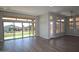 Bright living room featuring large sliding glass doors that provide seamless access to the backyard at 32513 N 135Th Dr, Peoria, AZ 85383