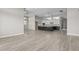 Open-concept living area with wood-look flooring seamlessly connects to the kitchen at 32513 N 135Th Dr, Peoria, AZ 85383