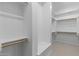 Spacious walk-in closet with built-in shelving and ample storage space at 32513 N 135Th Dr, Peoria, AZ 85383