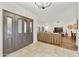 Inviting entryway with stone floors leads into a living area with high ceilings and warm neutral tones at 15857 E Ponderosa Dr, Fountain Hills, AZ 85268