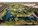 Scenic aerial view of community lake, playground, and green spaces at 1676 N Camden Dr, Florence, AZ 85132