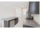 Spacious kitchen with stainless steel appliances, dark wood cabinets and tile flooring at 38120 W Excussare Way, Maricopa, AZ 85138