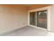 Covered patio with a sliding glass door that provides outdoor living space at 38120 W Excussare Way, Maricopa, AZ 85138