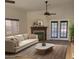 Inviting living room with a fireplace, ceiling fan, and french doors to the outside at 1523 E Black Diamond Dr, Gilbert, AZ 85296