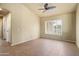 Empty bedroom with tile flooring, natural light, and neutral paint at 2606 N 159Th Dr, Goodyear, AZ 85395