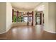 Bright dining area with a bay window, red curtains and neutral walls perfect for entertaining friends and Gathering at 2606 N 159Th Dr, Goodyear, AZ 85395