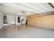 Bright, spacious garage with epoxy floor, cabinets, and a water heater at 2606 N 159Th Dr, Goodyear, AZ 85395