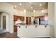 Bright kitchen with granite countertops, pendant lighting, and stainless steel appliances at 2606 N 159Th Dr, Goodyear, AZ 85395