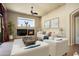 Cozy living room featuring a fireplace, plush seating, and neutral walls, enhanced by tasteful decor at 2606 N 159Th Dr, Goodyear, AZ 85395