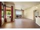 Open living area featuring tile flooring, fireplace with large window and sliding glass doors to the outdoor patio at 2606 N 159Th Dr, Goodyear, AZ 85395