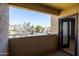 Balcony overlooking the complex with a door leading inside the apartment at 4925 E Desert Cove Ave # 350, Scottsdale, AZ 85254