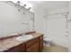 Bathroom featuring a vanity, sink, mirror, and a combined shower and tub at 4925 E Desert Cove Ave # 350, Scottsdale, AZ 85254