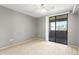Bright bedroom with sliding glass door access to outdoor patio space and ceiling fan at 4925 E Desert Cove Ave # 350, Scottsdale, AZ 85254