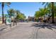 Welcoming entrance to community with lush landscaping, stately trees, and convenient parking at 4925 E Desert Cove Ave # 350, Scottsdale, AZ 85254