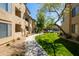 Beautifully landscaped apartment complex featuring lush green grass and mature trees at 4925 E Desert Cove Ave # 350, Scottsdale, AZ 85254