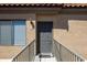 Inviting front entrance with a gray door, stylish railings, and a convenient window with horizontal blinds at 4925 E Desert Cove Ave # 350, Scottsdale, AZ 85254