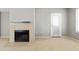 Bright living room with a fireplace, a glass patio door, and views of the surroundings at 4925 E Desert Cove Ave # 350, Scottsdale, AZ 85254